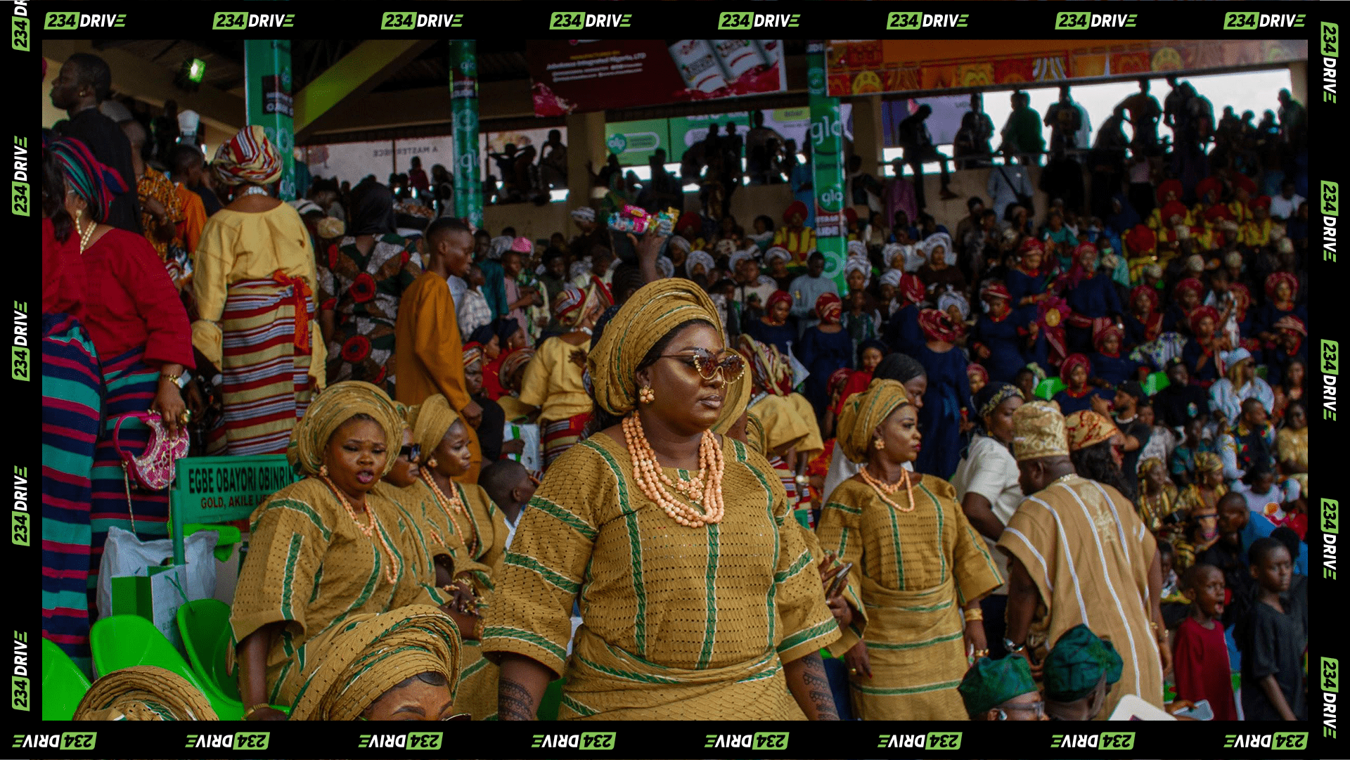 A woman elegantly dressed in traditional Aso-Oke attire at Ojude Oba.