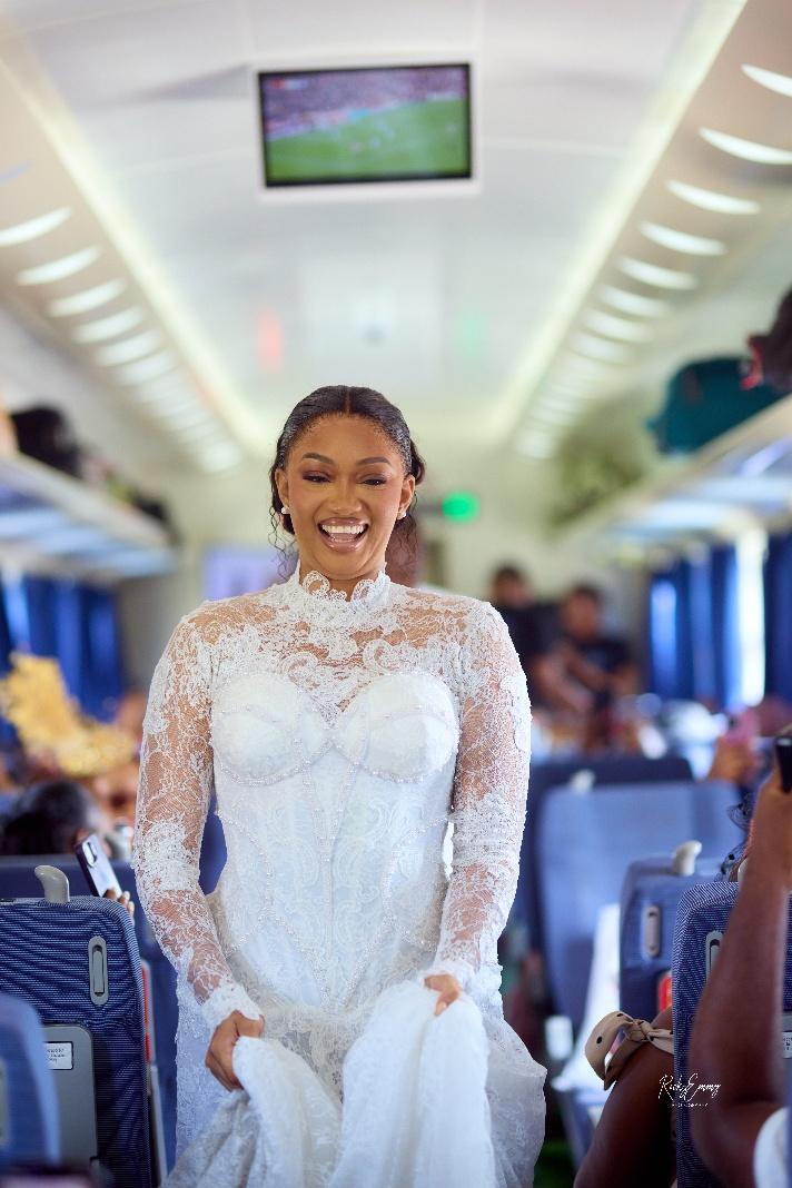 Sharon, the elated bride, walking down the train aisle. Source: Rocky Emmy Photography
