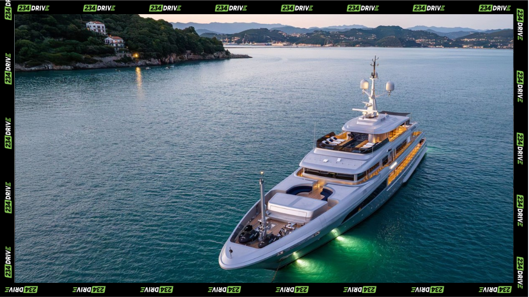 An aerial view captures Regina D’Italia anchored at twilight, her illuminated decks highlighting Mediterranean-ready luxury. Superyacht Regina D’Italia