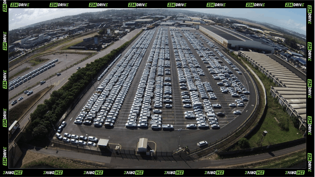Thousands of newly built cars sit ready for export in South Africa, showcasing the scale of the country’s car production.