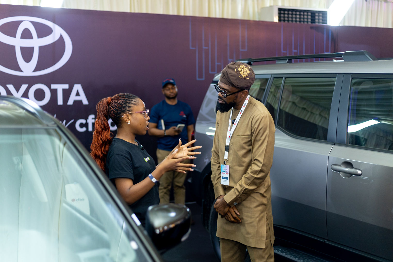 Olamide interviewing the General Manager of Toyota Nigeria, Mr Gboye 