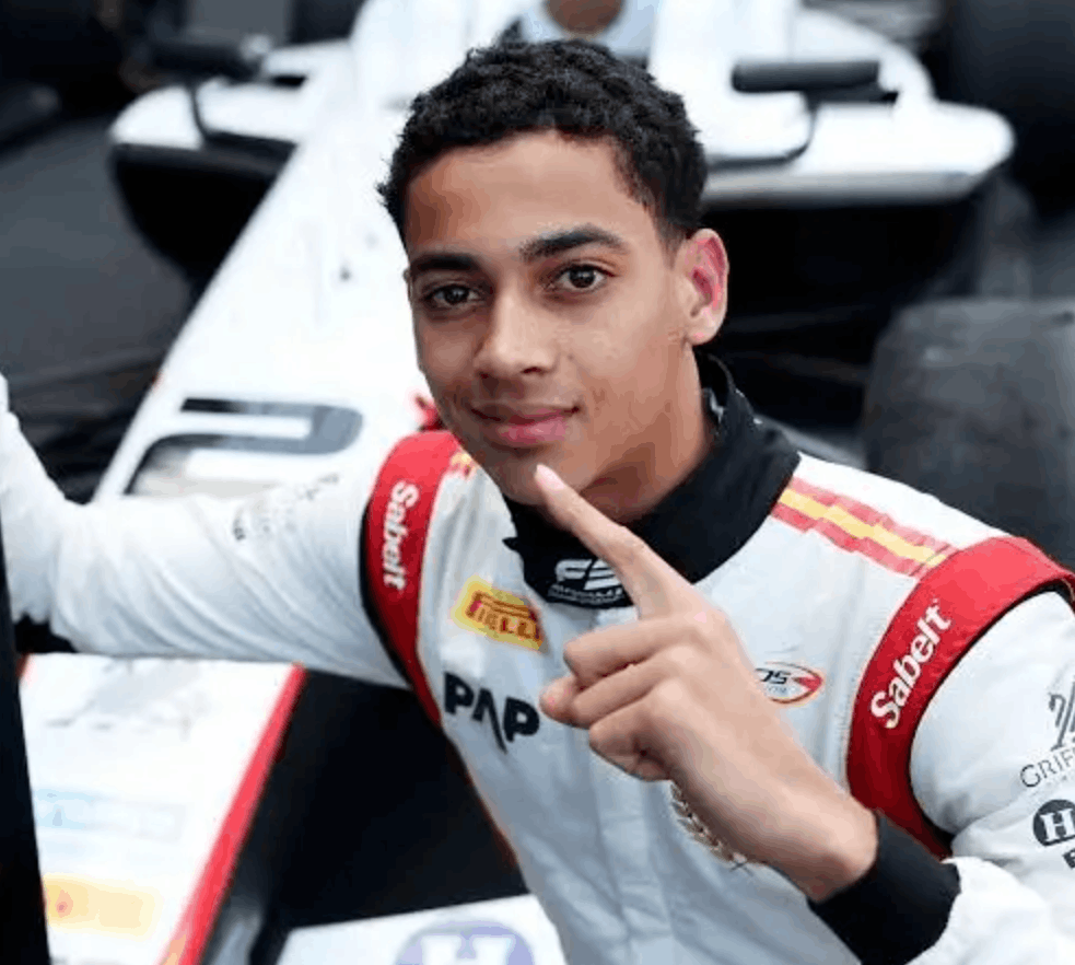 After his maiden FIA F3 win in Melbourne, Ugo Ugochukwu poses beside his Formula 3 car.