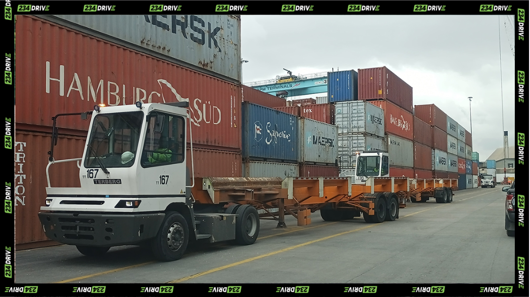 Container trucks move through a Nigerian port as stronger vehicle imports lift activity across the maritime sector. | Car import
