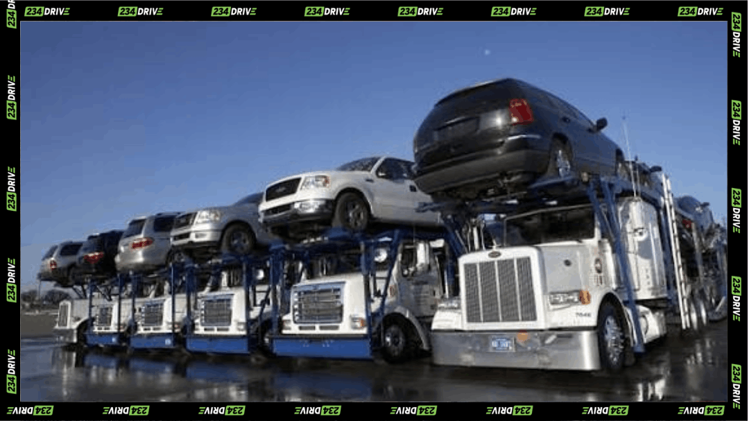 Car carrier trucks loaded with vehicles illustrate fake car trucking scams targeting dealer deliveries and imported cars across transport routes.