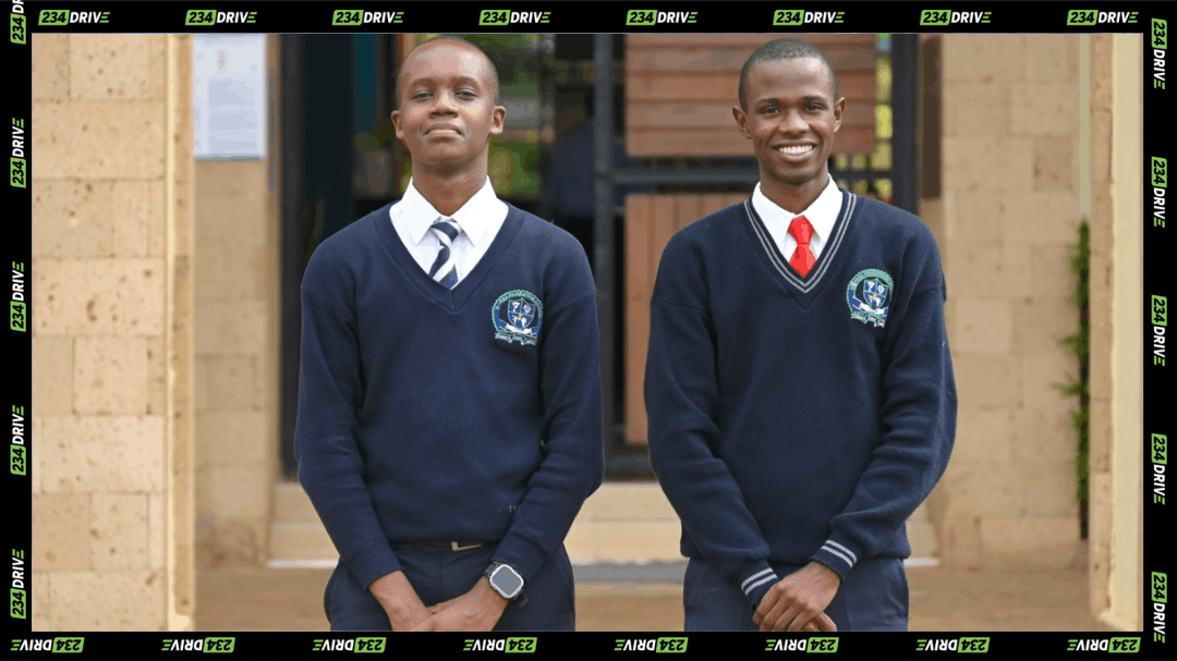 The Earth Prize 2026 Africa winners Fredrick Njoroge Kariuki, left, and Miron Onsarigo stand outside their Kenyan school.