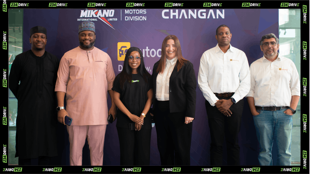 Representatives pose at a Mikano Motors and Autochek partnership event focused on improving vehicle financing and expanding car ownership access in Nigeria.