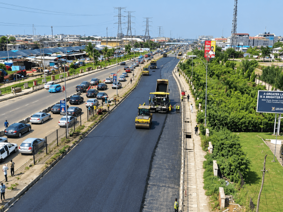 Aerial view of fresh asphalt being rolled on the Lekki-Epe Expressway while traffic queues on the opposite carriageway
