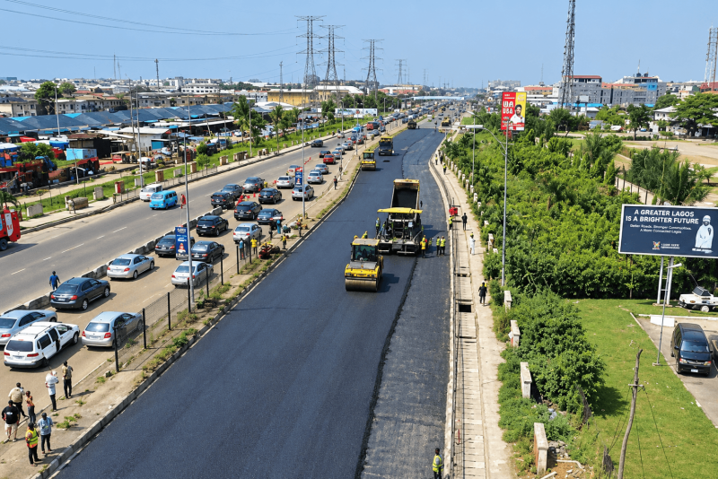 Aerial view of fresh asphalt being rolled on the Lekki-Epe Expressway while traffic queues on the opposite carriageway