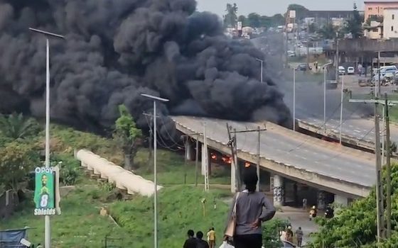 Thick black smoke rising beside Otedola Bridge in Lagos after a diesel tanker fell and caught fire