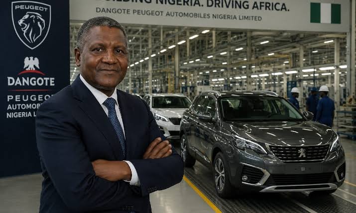 Aliko Dangote standing inside the Dangote Peugeot Automobiles Nigeria Limited assembly plant in Kaduna next to a modern Peugeot SUV
