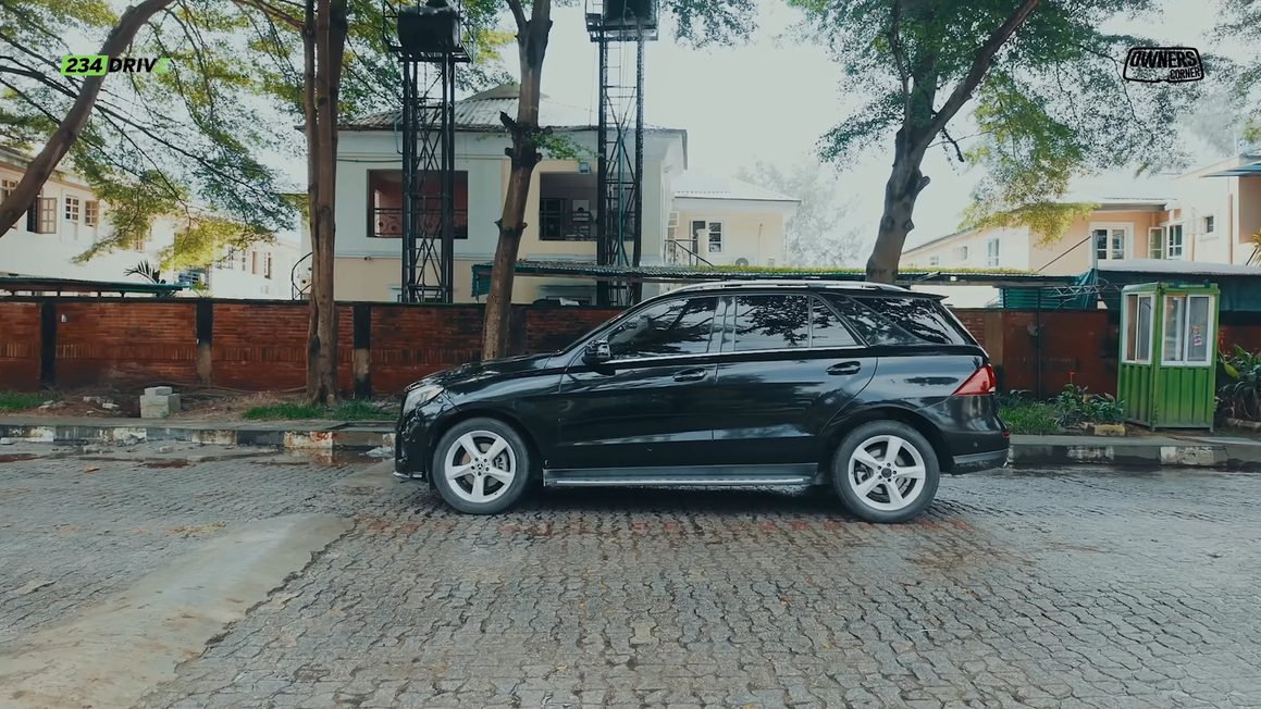 Side view of a black 2018 Mercedes-Benz GLE 350 parked on a cobblestone street in Lagos