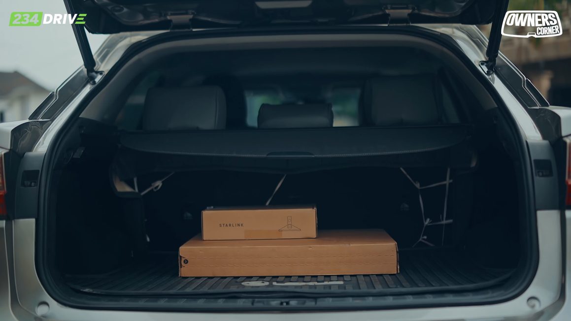 Open boot of the Lexus RX350 holding two cardboard boxes, the space Timilehin uses for Eco20 events